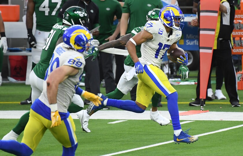 Rams wide receiver Robert Woods runs after making a catch.