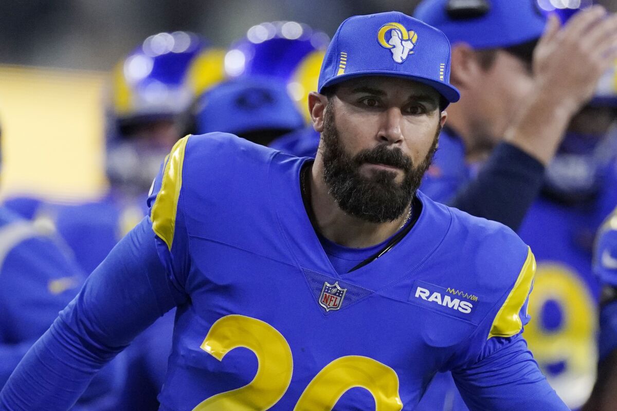 FILE - Los Angeles Rams defensive back Eric Weddle (20) congratulates teammates during the second half of an NFL wild-card playoff football game against the Arizona Cardinals in Inglewood, Calif., Monday, Jan. 17, 2022. Weddle played 12 NFL seasons, then retired after the 2019 season. Thanks to a call from the Los Angeles Rams, the two-time All Pro safety finally will play in the game that eluded him in stints with the Chargers and Baltimore. (AP Photo/Mark J. Terrill, File)
