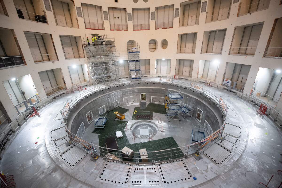 Technicians work on the tokamak building of the ITER project in France. 