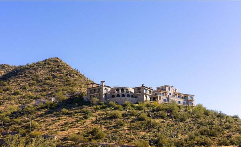 Built in 2021, the scenic mega-mansion is called Altitude and sits atop a peak overlooking Scottsdale.