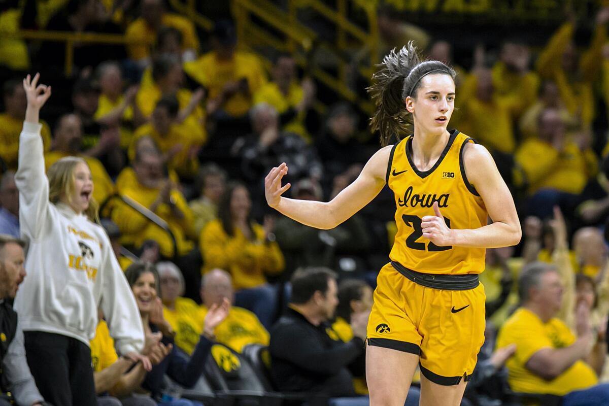 Iowa guard Caitlin Clark reacts after making a 3-point basket during an NCAA college basketball game against Wisconsin Wednesday, Feb. 15, 2023, in Iowa City, Iowa. (Joseph Cress/Iowa City Press-Citizen via AP)