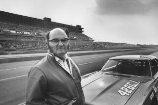 Los Angeles Times motor sports writer Shav Glick in a 1971 photo at an unknown track.