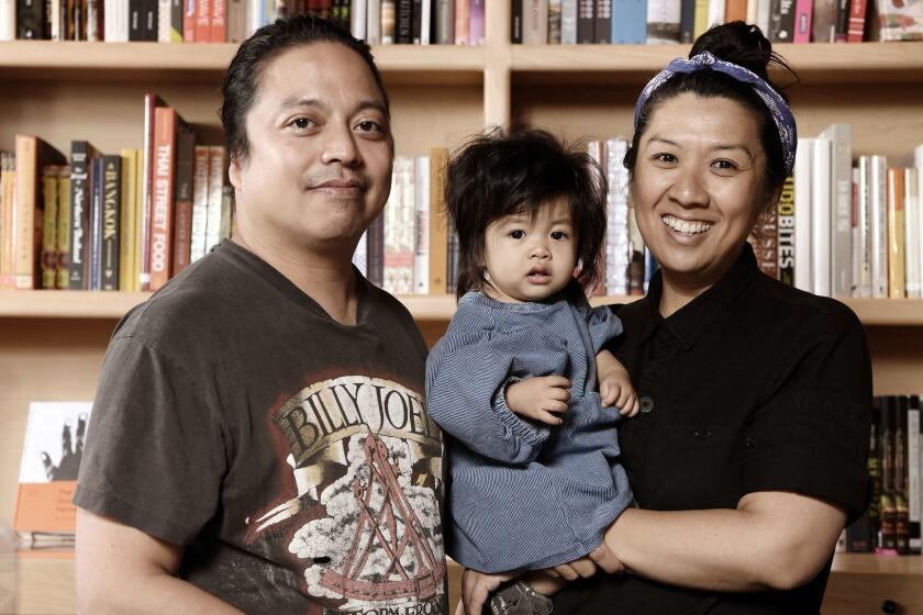 LOS ANGELES CA-January 30, 2019: Now Serving cookbook store owners Ken Concepcion, Michelle Mungcal and their daughter, Frankie on Wednesday, January 30, 2019. (Mariah Tauger / Los Angeles Times)