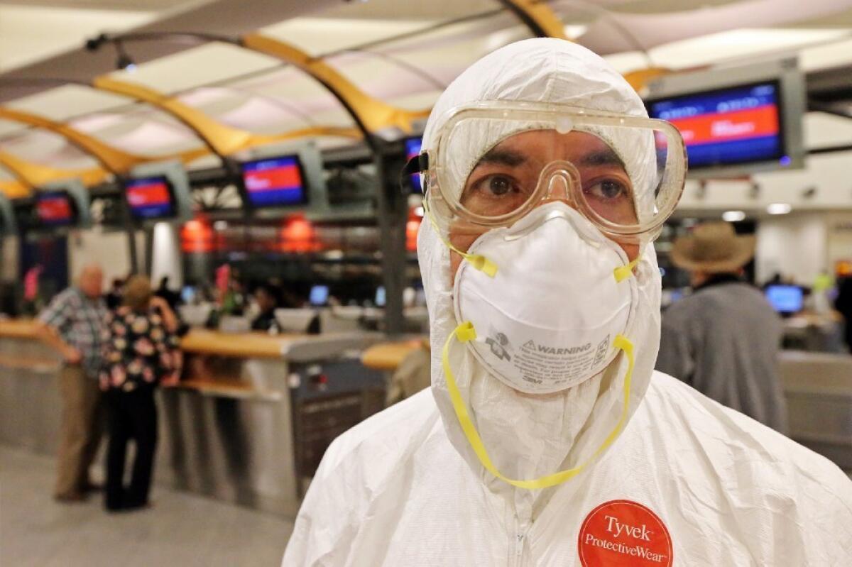 Two days after a man in Texas was diagnosed with Ebola, Dr. Gil Mobley, a Missouri doctor, checked in and boarded a plane dressed in full protection gear at Hartsfield-Jackson Atlanta International Airport to protest what he called mismanagement of the Ebola virus by U.S. officials.