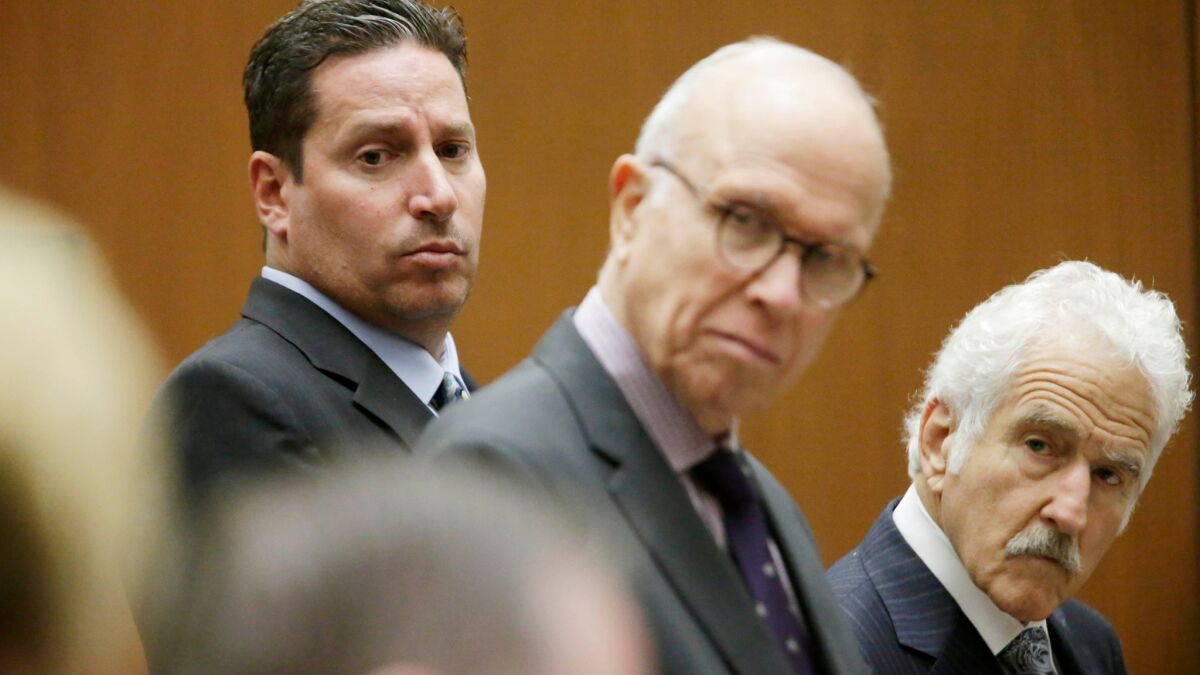 Todd DeStefano, a former executive at the Los Angeles Memorial Coliseum, with by his attorneys Richard Hirsch, center, and Michael Nasatir, right, was sentenced to six months in jail.
