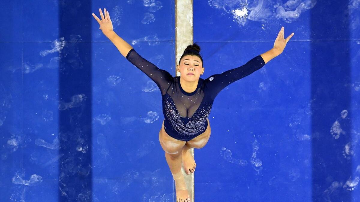 UCLA gymnast Kyla Ross competes on the beam at Pauley Pavilion.