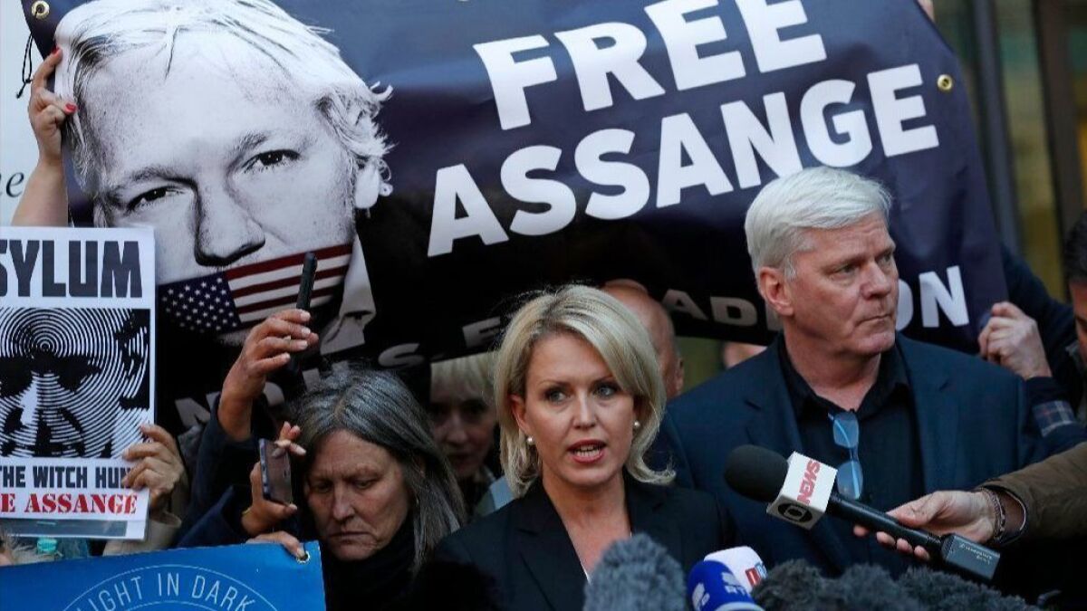 Kristinn Hrafnsson, editor of WikiLeaks, right, and lawyer Jennifer Robinson, center, speak to the media outside Westminster Magistrates Court where WikiLeaks founder Julian Assange was appearing in London on April 11, 2019.