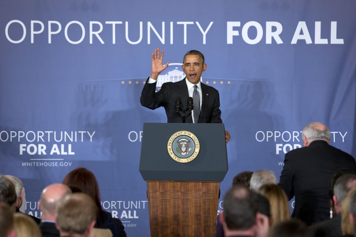 President Obama waves after announcing plans for two manufacturing innovation institutes at the White House.