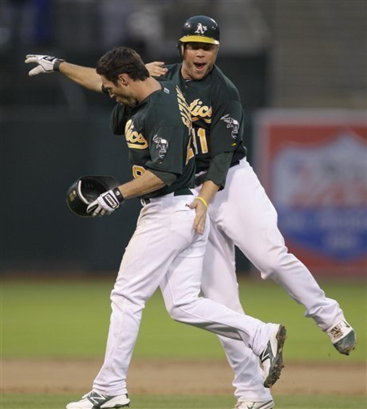 A's split doubleheader with Angels