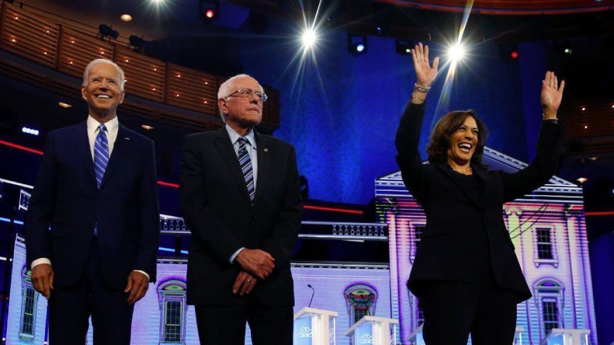 Former vice president Joe Biden, Sen. Bernie Sanders of Vermont and Sen. Kamala Harris of California before they clashed in last month's Democratic primary debate in Miami.