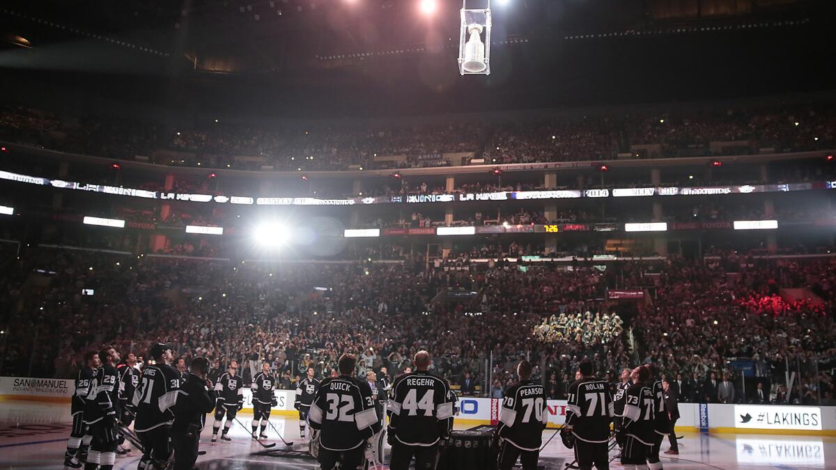 The Stanley Cup descends to center ice during the Kings' Stanley Cup banner raising ceremony at Staples Center on Wednesday.