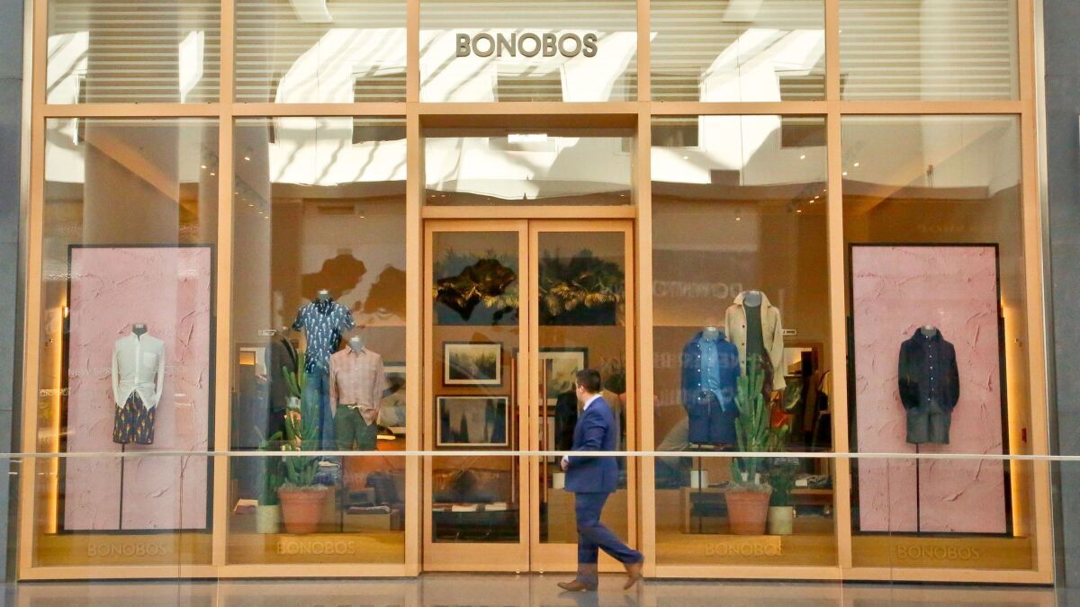 A man walks by the Bonobos Guideshop in New York in March.