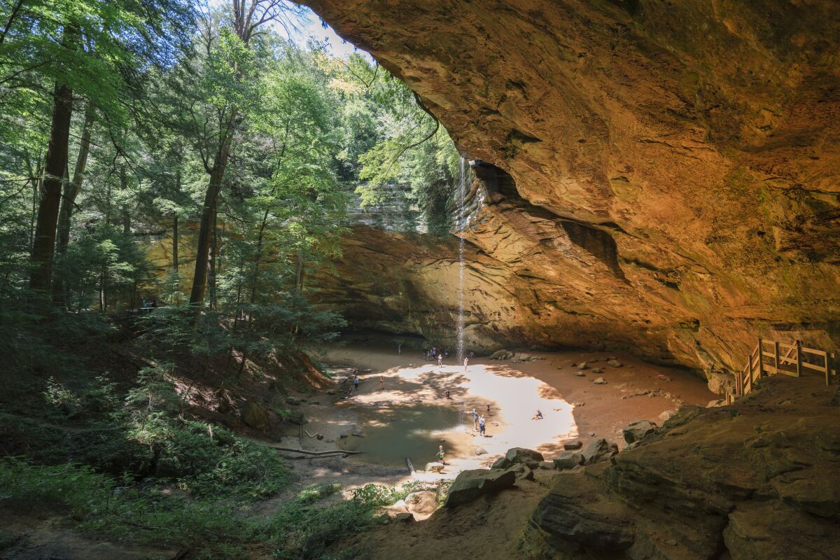 A quarter-mile, wheelchair-accessible trail from the Hocking Hills Scenic Byway in Ohio leads to Ash Cave.