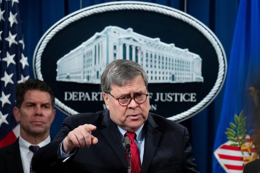 Mandatory Credit: Photo by MICHAEL REYNOLDS/EPA-EFE/REX (10553038c) US Attorney General William Barr participates in a news conference in front of FBI Deputy Director David Bowdich (Back), at the Justice Department in Washington, DC, USA, 10 February 2020. The press conference was held to announce the indictment of four members of the Chinese People's Liberation Army (PLA) with computer hacking into the credit reporting agency Equifax. The nine-count indictment alleges the Chinese military personnel stole the sensitive personal data of approximately 145 million Americans. US Justice Department announces the indictment of four members of the Chinese People's Liberation Army (PLA), Washington, USA - 10 Feb 2020 ** Usable by LA, CT and MoD ONLY **