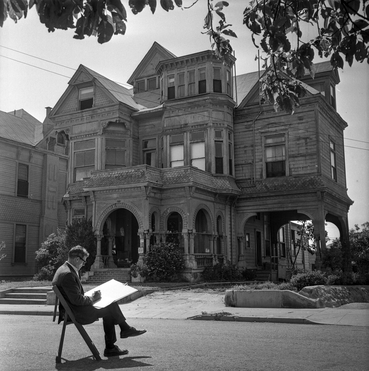 Leo Politi sketches the Victorian home known as the Castle in 1964. The Wells Fargo Center on Grand Avenue has since replaced it.