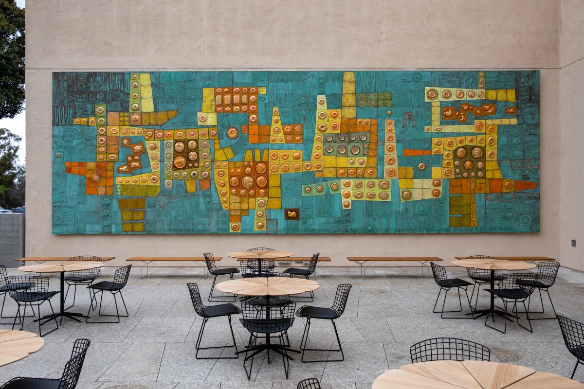 A terrace features a Modernist enamel-and-copper mural-sculpture whose forms were inspired by the patterns on currency