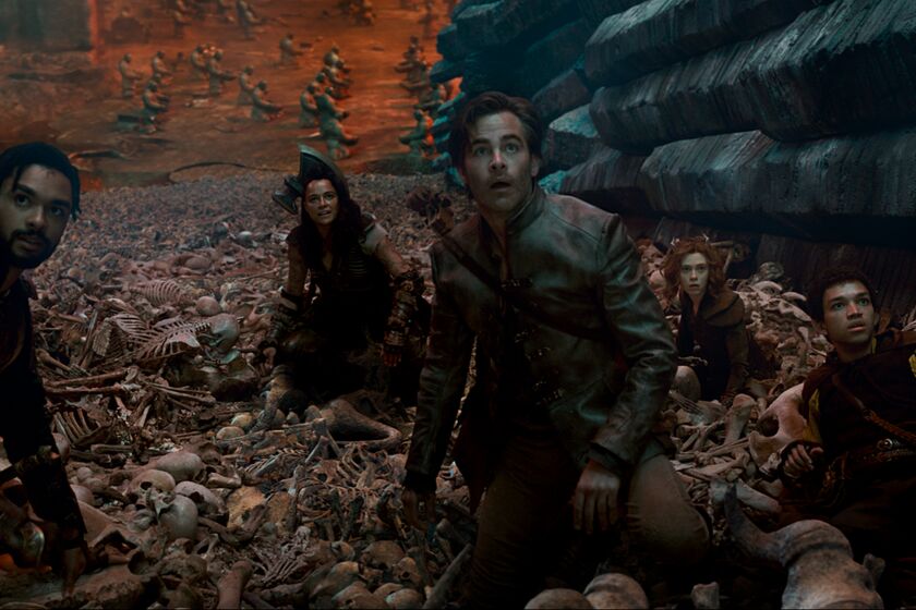 Rege Jean Page, Michelle Rodriguez, Chris Pine, Sophia Lillis and Justice Smith wade through a mound of skeletons.