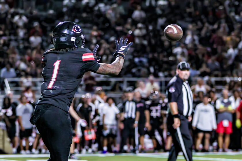 Receiver Quentin Hale of Corona Centennial shows off his hands and focus against Santa Margarita.