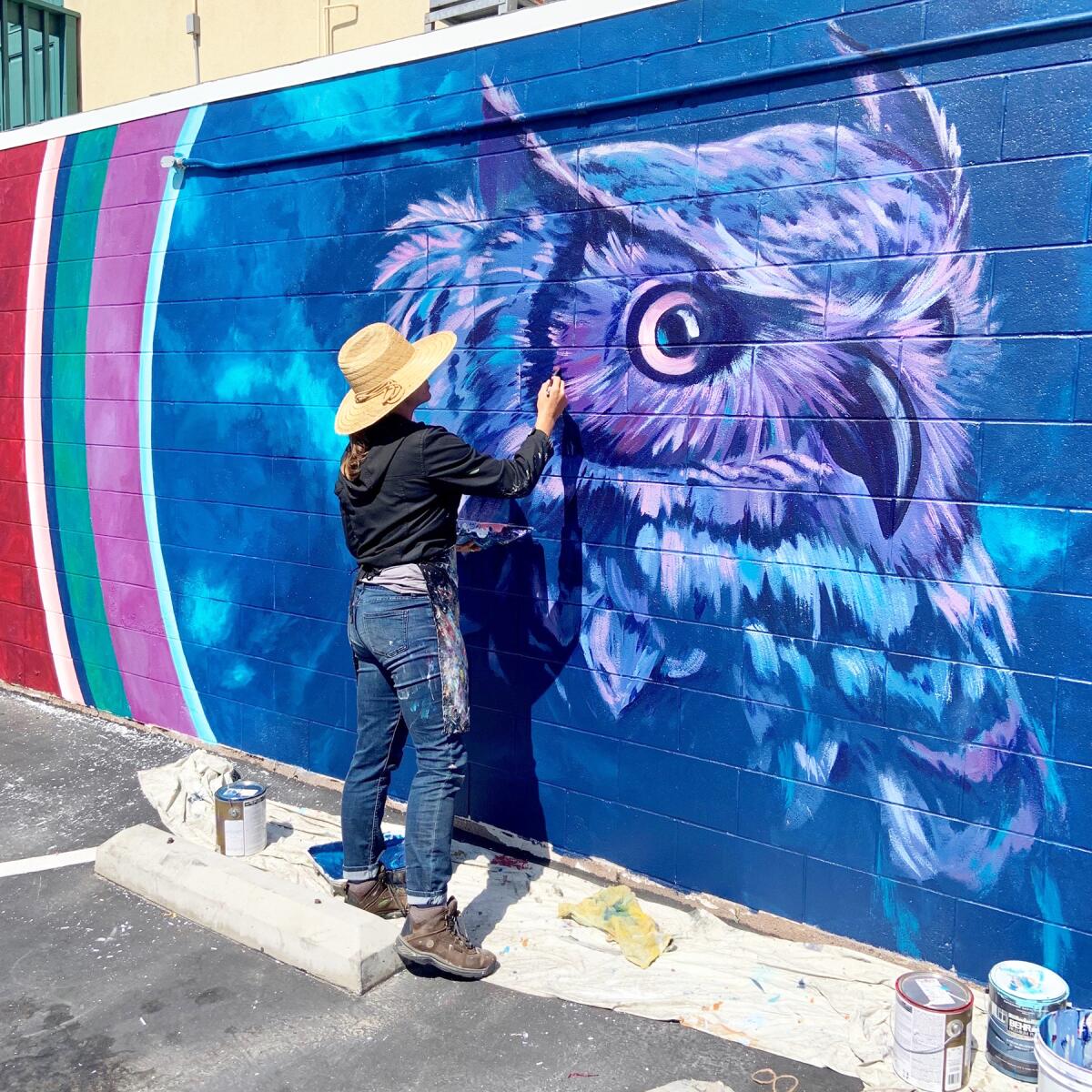 The iconic owl on Pacific Beach’s Night Owl Cocktail Lounge, while being painted by artist Hanna Daly.