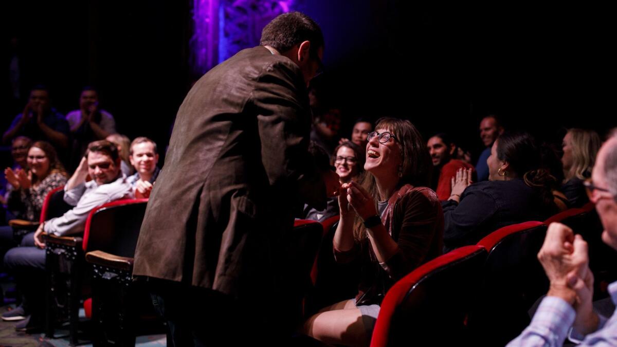 Jake Penzell proposes to Jaimie Szuhay (she said yes) during "Schitt's Creek: Up Close & Personal" at the Theatre at Ace Hotel on Sunday.