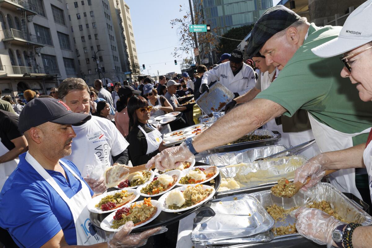 Volunteers serve a Thanksgiving meal in downtown Los Angeles.
