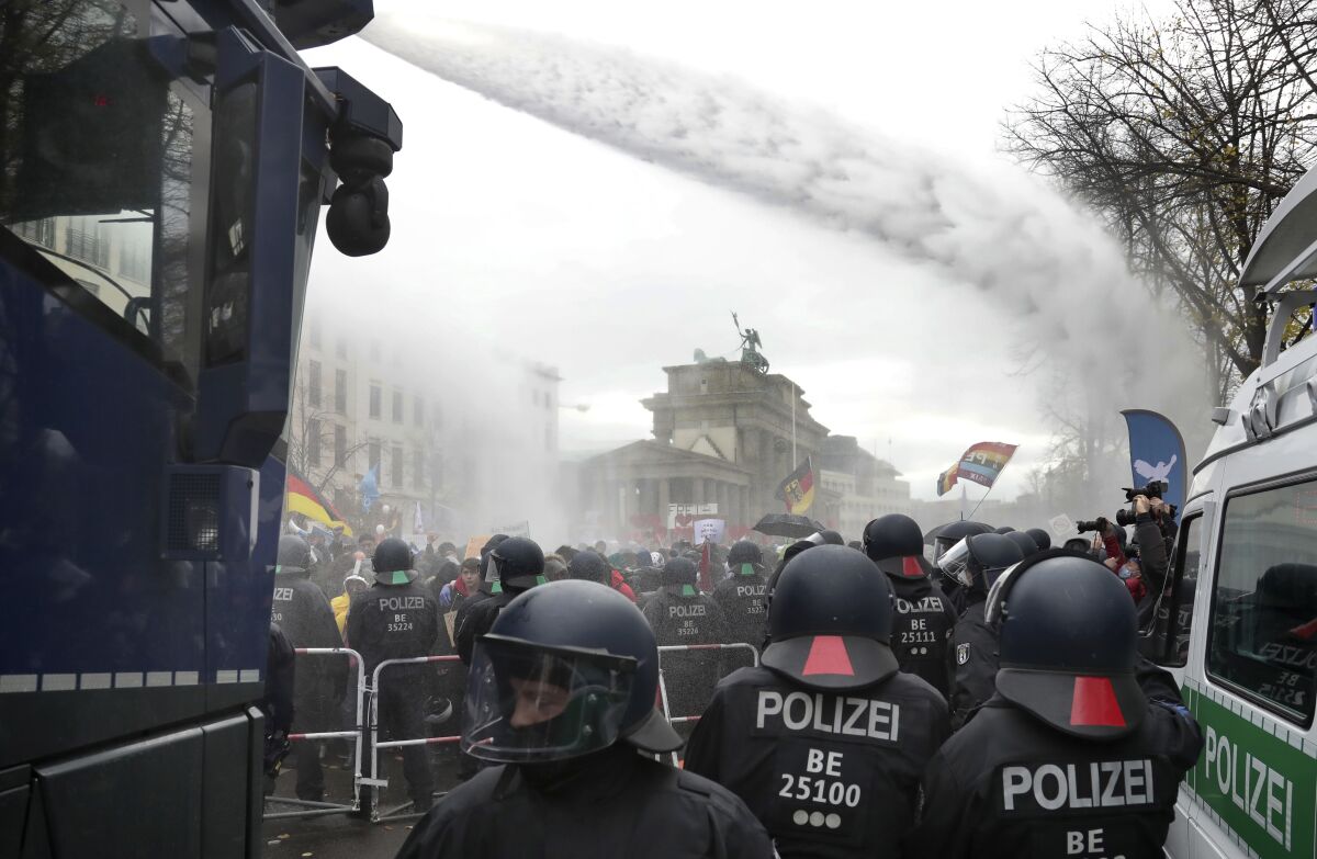 Police using water cannons to disperse protesters