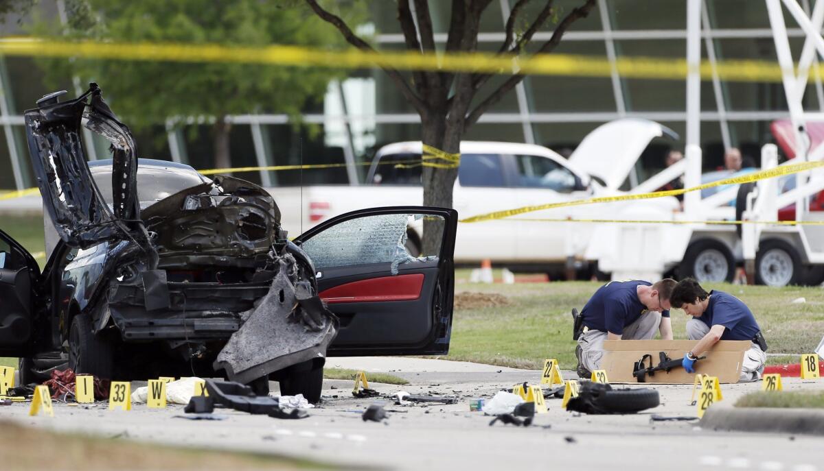 Investigators box up an assault weapon outside the Curtis Culwell Center in Garland, Texas, in May after an attack on a "draw Muhammad" cartoon contest.