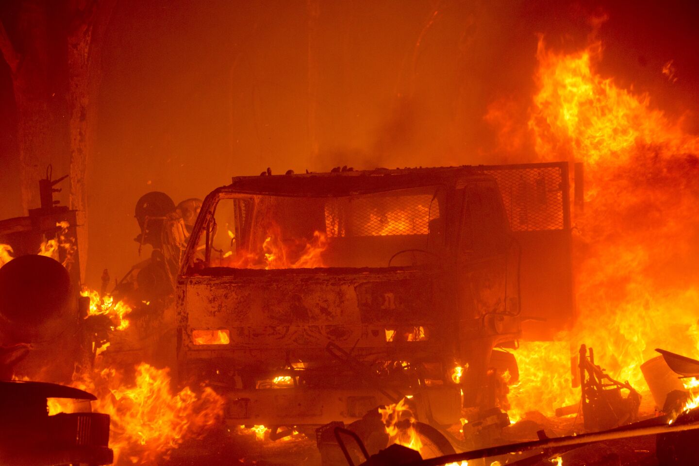 The Lake Hughes fire burns vehicles in Angeles National Forest.