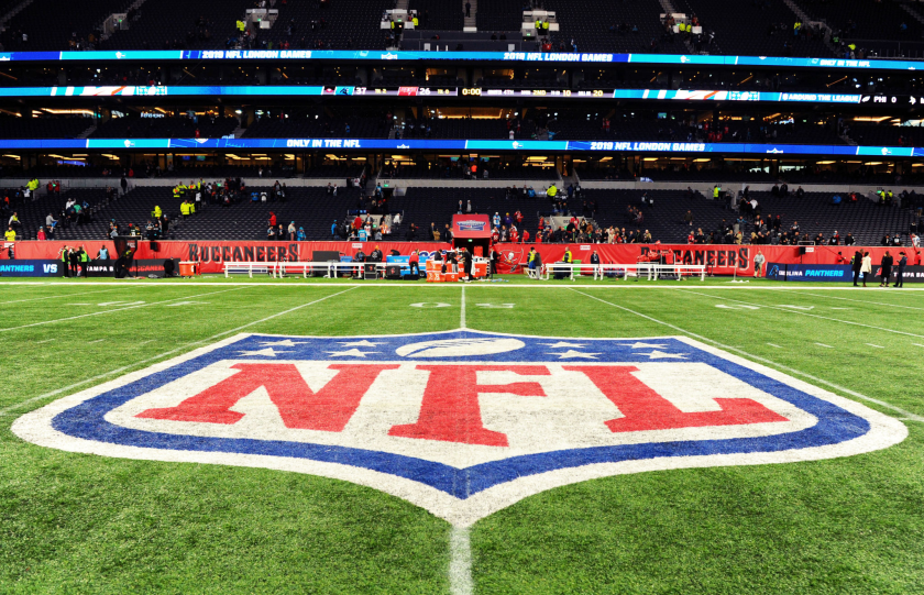 Detailed view of the NFL logo on the field.