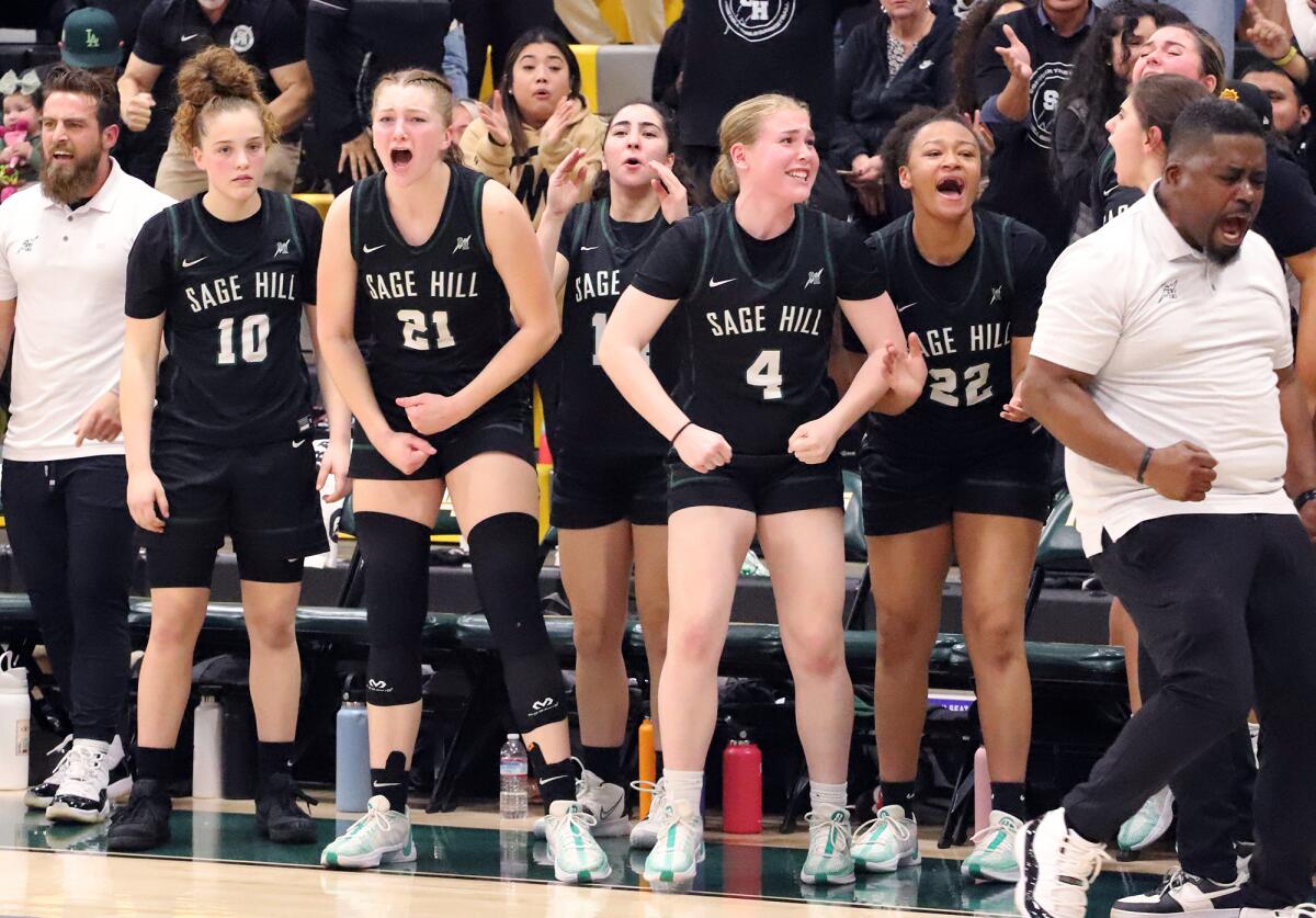 Sage Hill's girls' basketball team cheers after a key defensive stop in the last minute against Ontario Christian.