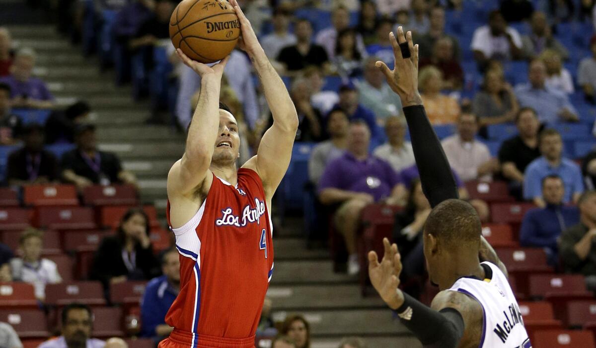 Clippers guard J.J. Redick shoots a jumper over Kings guard Ben McLemore in the first half.