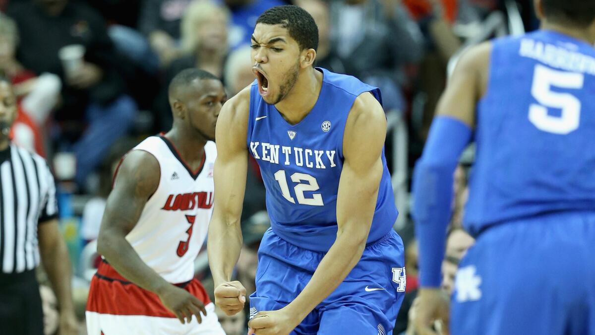 Freshman forward Kentucky Karl-Anthony Towns celebrates during the Wildcats' 58-50 win over Louisville on Saturday.