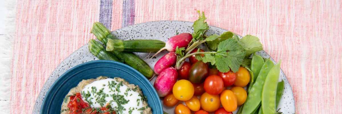 Smoky eggplant dip with ginger and tomato chutney with colorful crudites