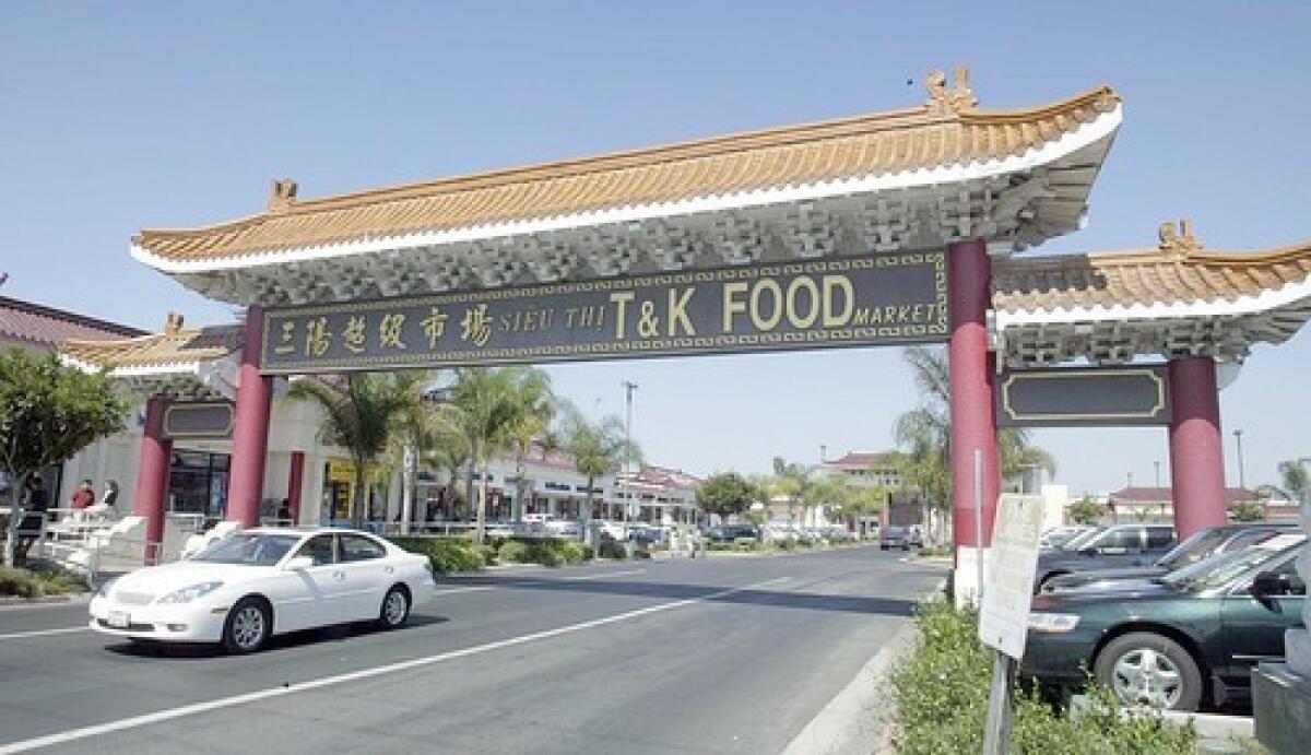 A gateway leads to a shopping plaza in Westminster's Little Saigon, where Vietnamese businesses and culture thrive.