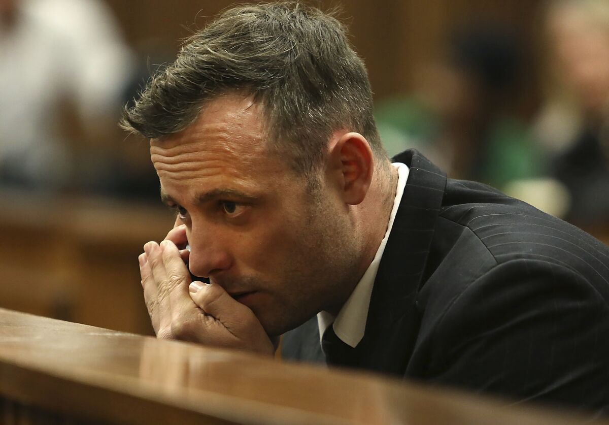 Oscar Pistorius speaks on a mobile phone during his sentencing hearing in Pretoria, South Africa, June 15, 2016