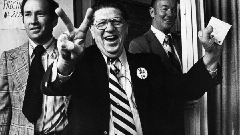 Howard Jarvis, chief sponsor of Proposition 13, signals victory as he casts his own vote in Los Angeles on June 6, 1978.