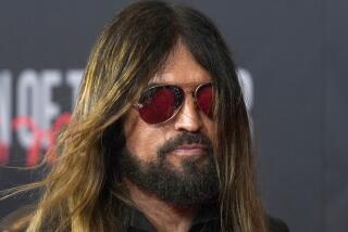 Billy Ray Cyrus arrives at the 31st annual MusiCares Person of the Year benefit gala honoring Joni Mitchell on Friday, April 1, 2022, at the MGM Grand Conference Center in Las Vegas. (AP Photo/Chris Pizzello)