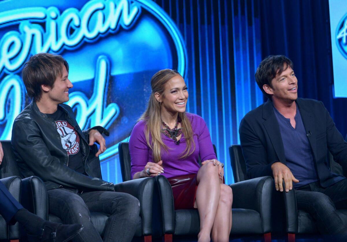 Judges Keith Urban, Jennifer Lopez, and Harry Connick Jr. are seen during the panel of "American Idol" at the FOX Winter 2014 TCA in Pasadena, Calif.