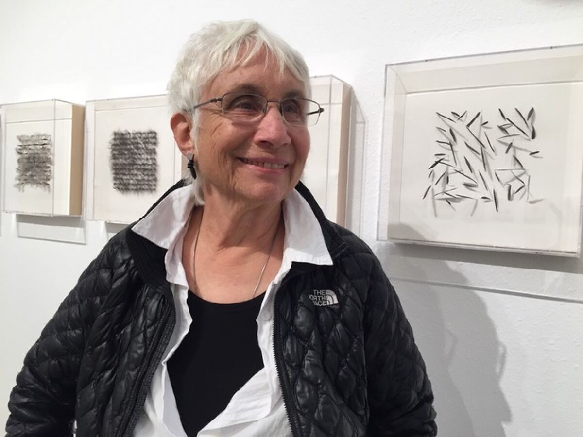 Artist/storyteller Judy Tuwaletstiwa, with some pieces of “The Crow.”