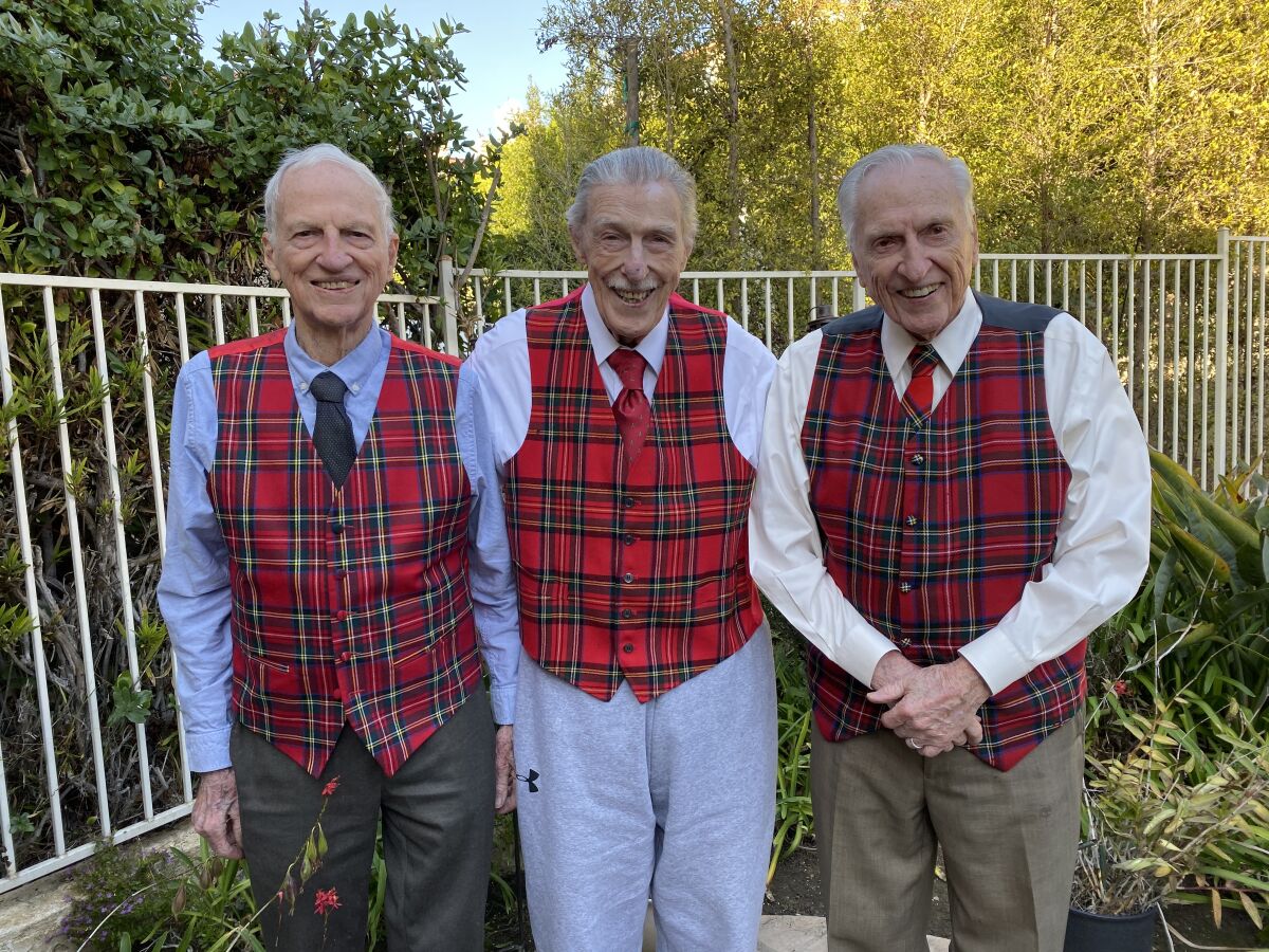 Ray Stewart, 93, Bill Stewart, 100, and Stan Stewart, the baby, pose in the backyard of Stan’s La Jolla house on his 90th birthday. The vests honor their Scottish heritage.