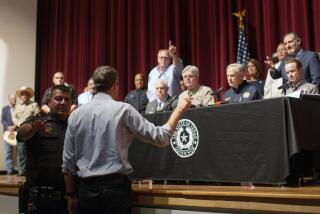 Democrat Beto O'Rourke, who is running against Greg Abbott for governor in 2022, interrupts a news conference headed by Texas Gov. Greg Abbott in Uvalde, Texas Wednesday, May 25, 2022. (AP Photo/Dario Lopez-Mills)
