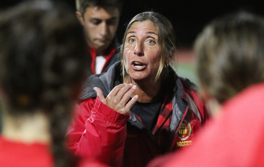 Don Head Coach Dawn Lee exhorts her squad prior to Wednesday's OT period.