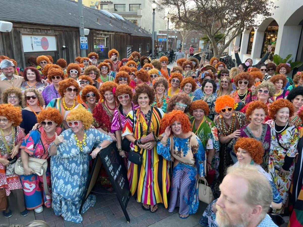 Dozens of women dressed as Mrs. Roper participated in a pub crawl in Huntington Beach in January.
