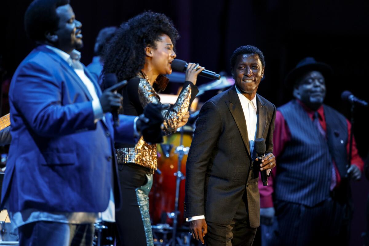 Craig Robinson, left, Judith Hill and Kenneth "Babyface" Edmonds perform Wednesday at the Hollywood Bowl.
