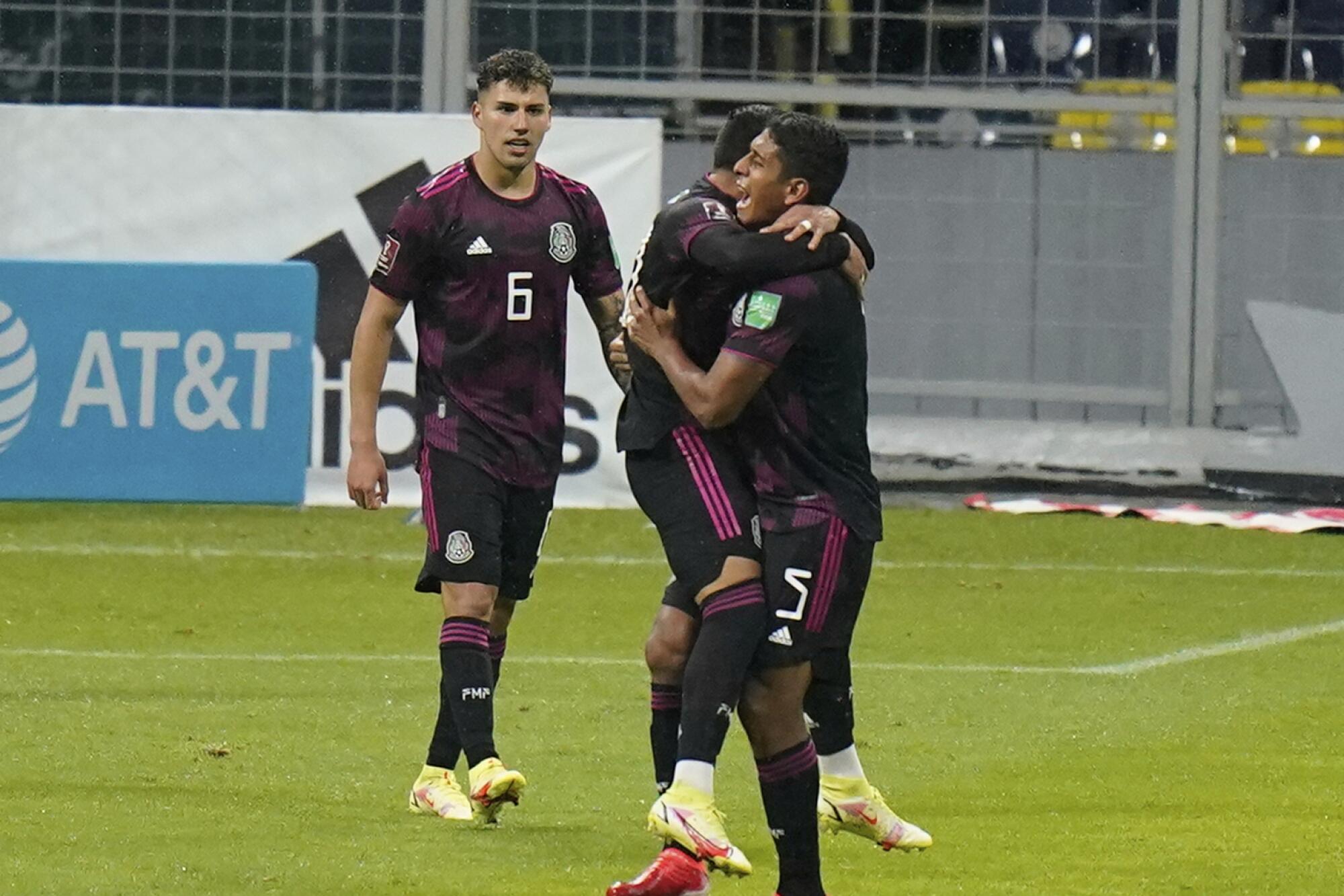 Mexico's Ernesto Vega, center, celebrates with teammates after scoring the opening goal against Jamaica.
