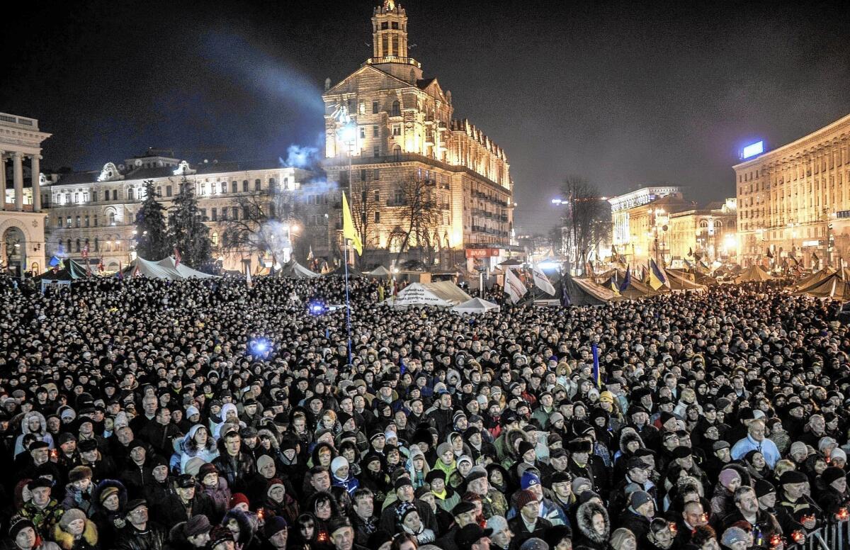 A crowd waits in Kiev’s Independence Square to hear the names of the new Cabinet members. “There is not a single name on the list associated in any way with Yanukovich’s regime,” said analyst Igor Popov.