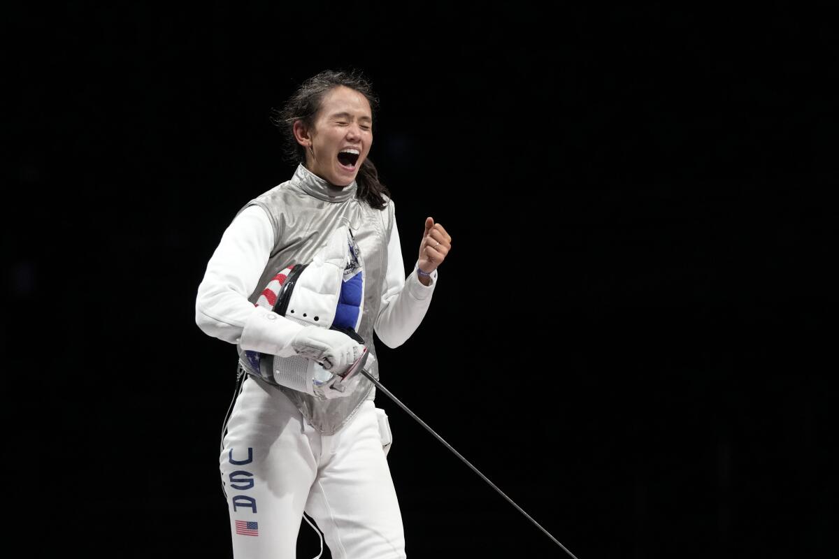 Lee Kiefer celebrates after winning gold in women's individual foil at the Tokyo Olympics in July 2021.