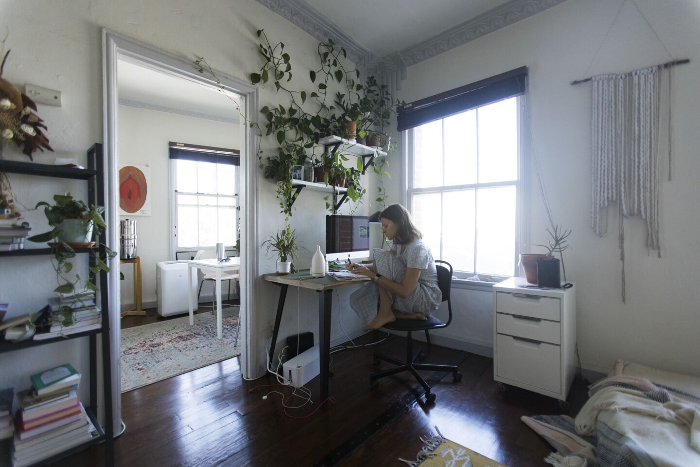 Wellness blogger Lee Tilghman works in her Koreatown apartment.