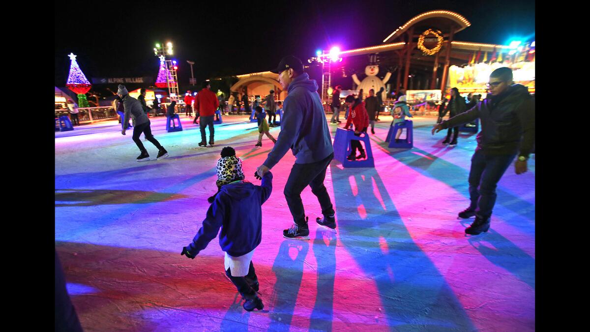 Families skate on the ice rink under the lights in 2017 at Winter Fest OC, which returns to the OC Fair & Event Center in Costa Mesa on Dec. 19.