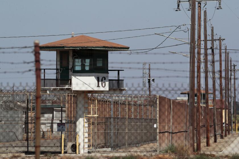 Chino, CA, Tuesday, July 21, 2020 - Outside the California Institute for Men, Chino. The Chino prison reported more than 600 cases of COVID-19 and nine deaths. The 700 inmates selected for transfer had medical conditions that made them especially vulnerable to the virus. (Robert Gauthier / Los Angeles Times)